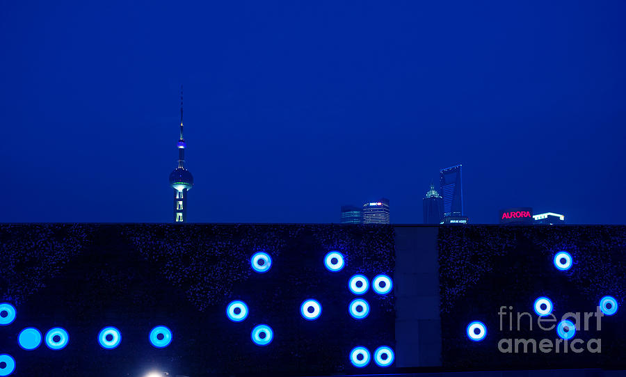  - 1-shanghai-skyline-peeping-over-a-illuminated-wall-at-dusk-jan-marijs