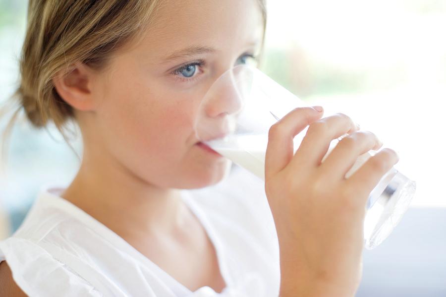 Girl Drinking Milk Photograph By Ian Hooton Science Photo Library