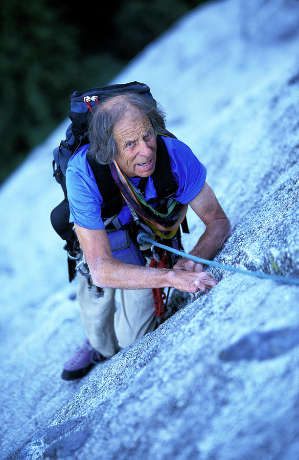 An Elderly Rock Climber Climbs A Crack Photograph By Corey Rich Fine