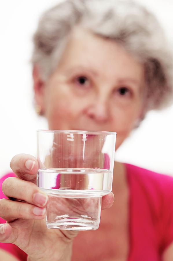 Elderly Woman With A Glass Of Water Photograph By Lea Paterson Science