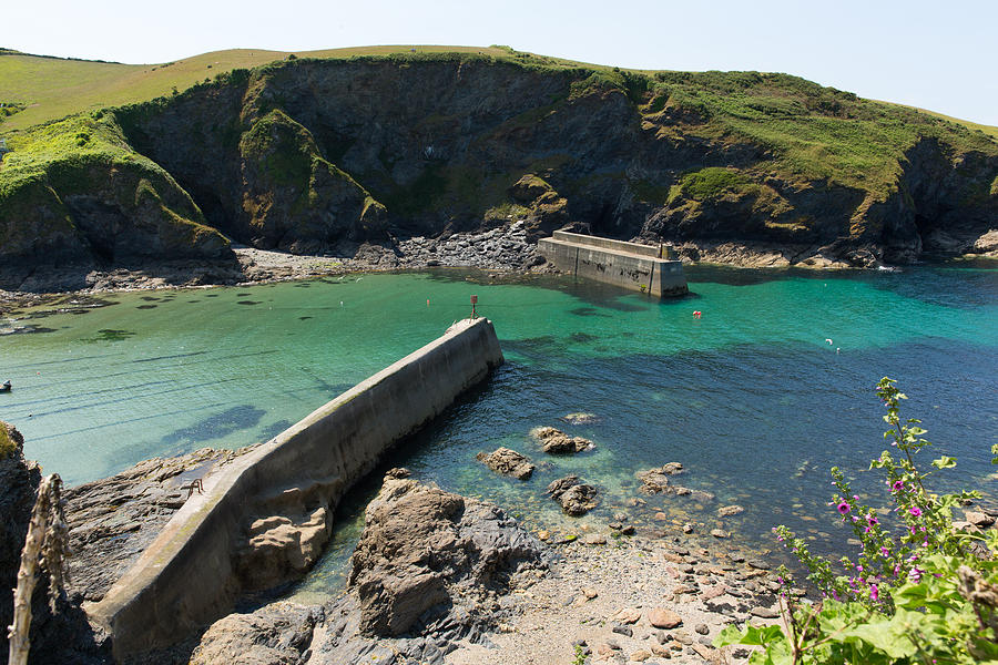 Port Isaac Harbour Walls Cornwall England Uk With Blue Sea On A