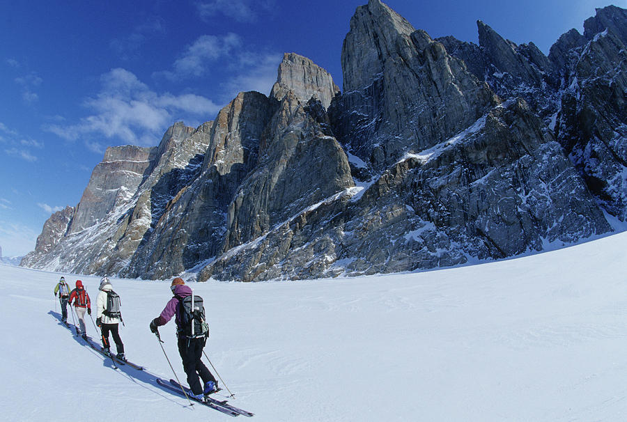 Skiers Traversing Across Frozen Fjord Photograph By Whit Richardson