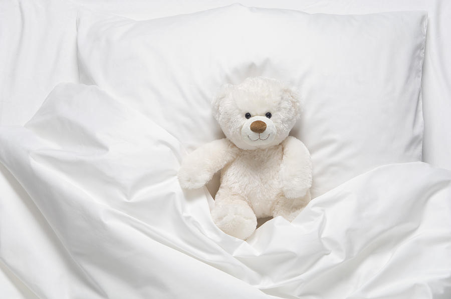 bed with teddy bear