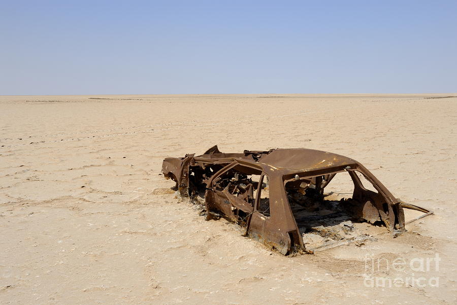 Abandoned and rusty car wreck in desert Photograph Abandoned and rusty car