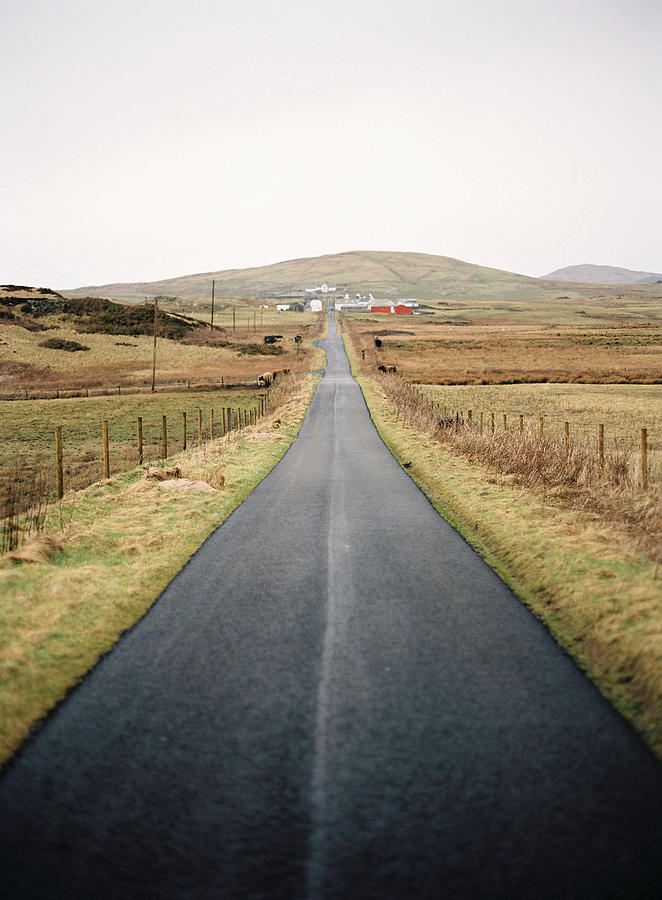 Long Straight Road Surrounded By Peaty Fields Photograph by