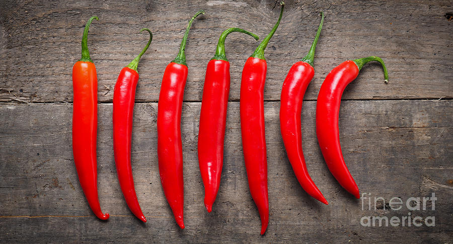 Red Chilies On Wood Photograph By Andreas Berheide