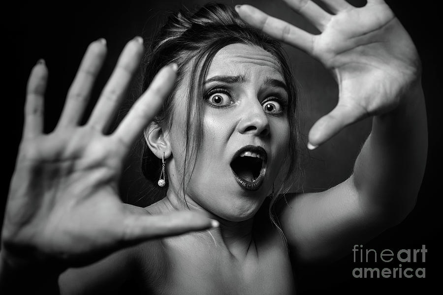 Scared attractive woman screams fan images