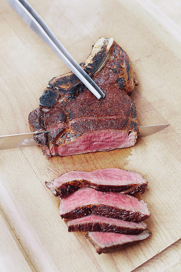 A Steak Made In A Beefer Being Sliced Photograph By Tre Torri Fine