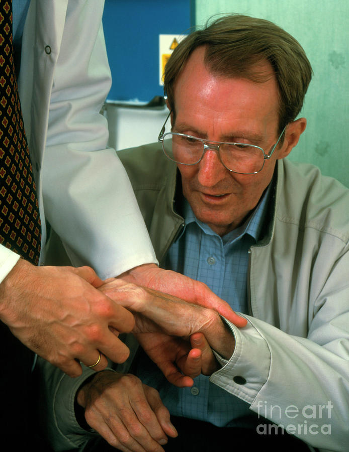 Hand Examination Of Man With Parkinson S Disease Photograph By Simon