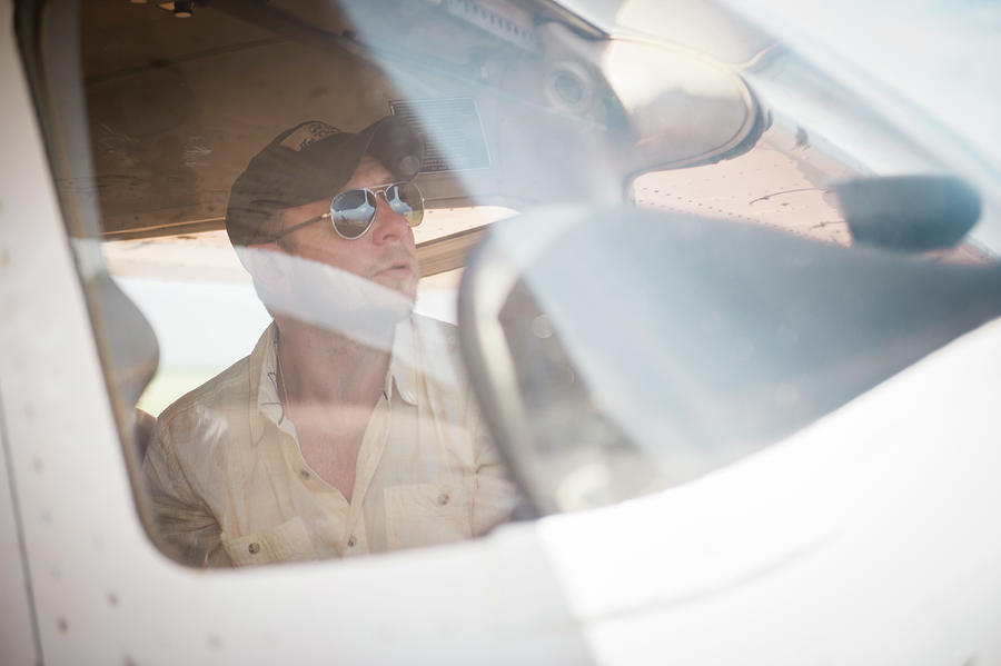 Pilot Looking Out Cockpit Window Photograph By Cavan Images