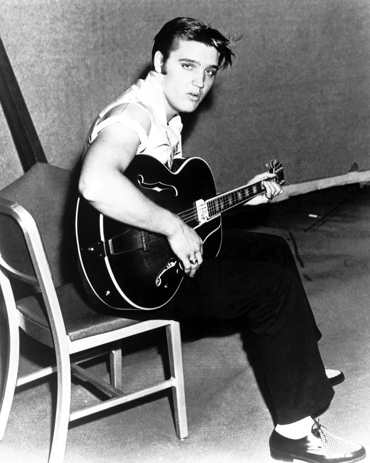 Portrait Of Elvis Presley Playing Guitar Photograph By Globe Photos