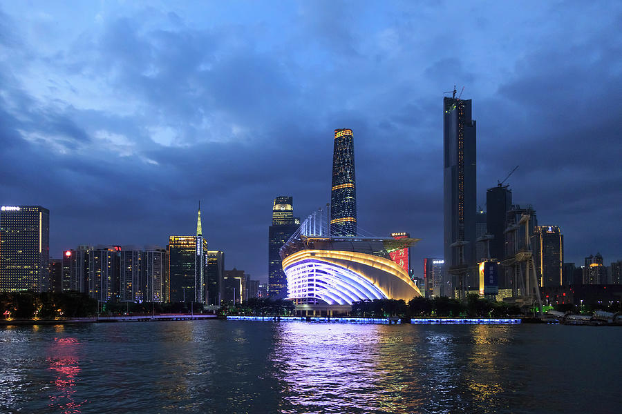 Riverfront Olympic Stadium And Floating Restaurant Illuminated At Night