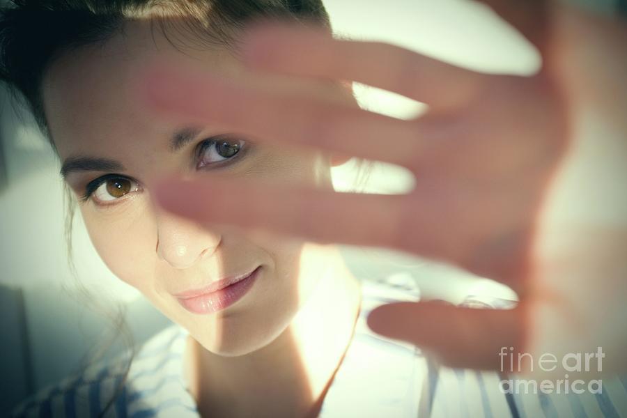 Woman Shielding Her Eyes From Sun Photograph By Ian Hooton Science