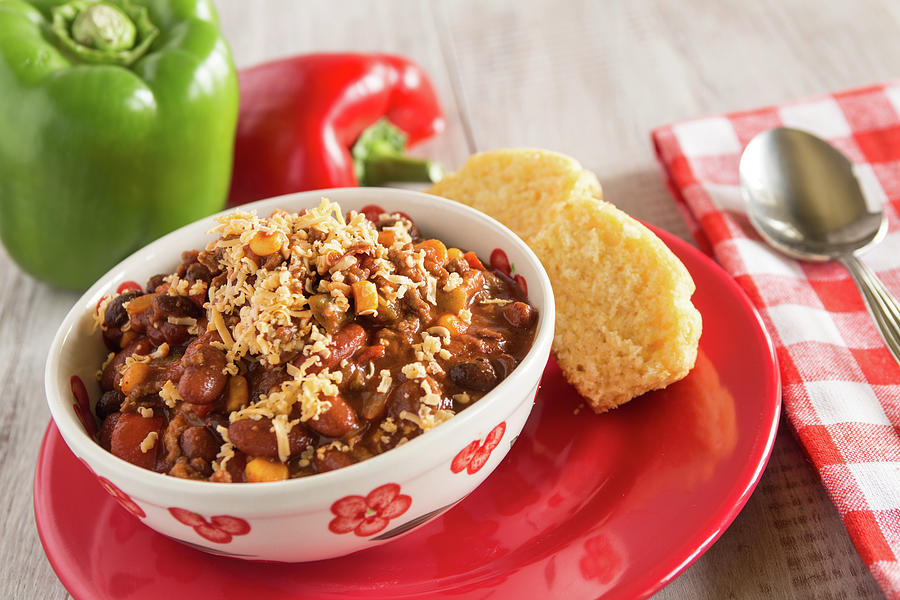 Bowl Of Chili With Corn Bread Muffin And Peppers Photograph By Carol