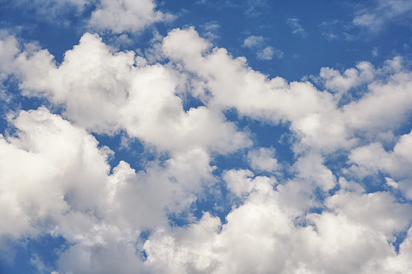 Fluffy Clouds Blue Sky Background Throw Pillow by Akurtz 