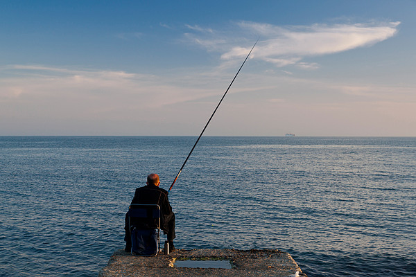 Man Pier Fishing, Lighthouse Beach Face Mask by Panoramic Images - Fine Art  America