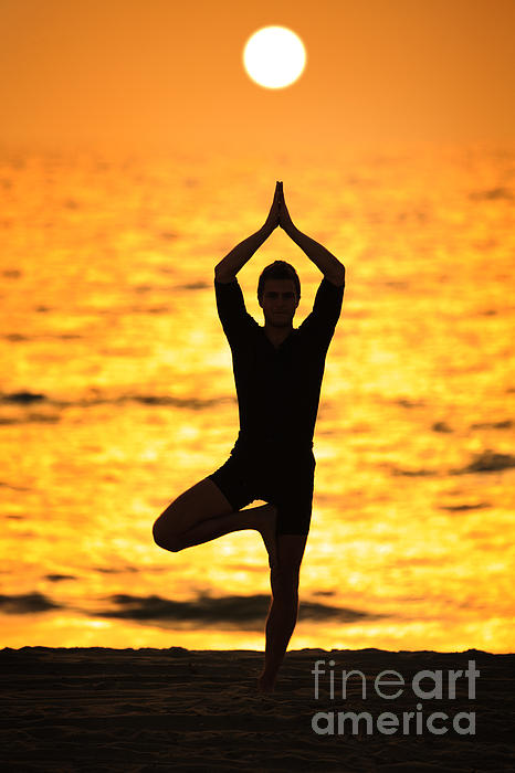 Silhouette of A young girl practicing Yoga vrikshasana tree pose on  tropical beach with sunset sky background, watching the sunset, background  and copy space. Stock Photo | Adobe Stock