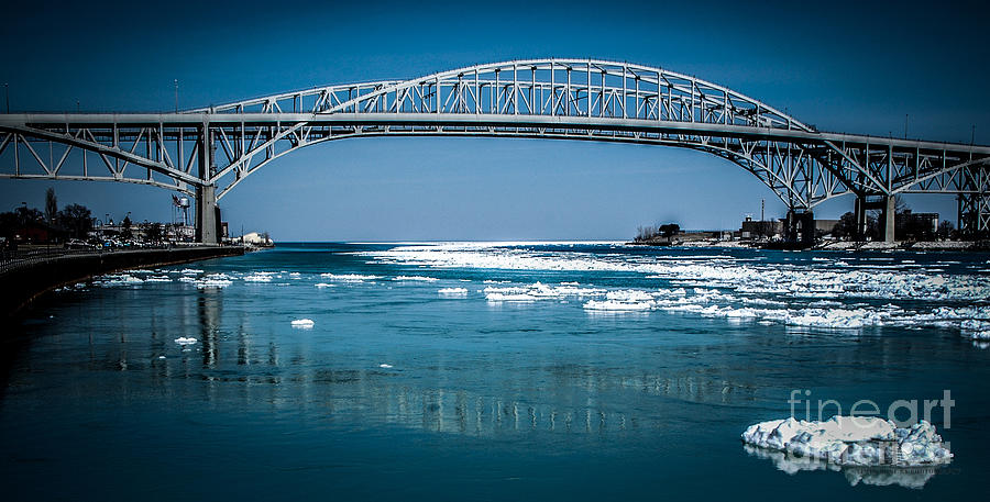  Blue Water Bridges with reflection and Ice Flow Photograph by Ronald Grogan