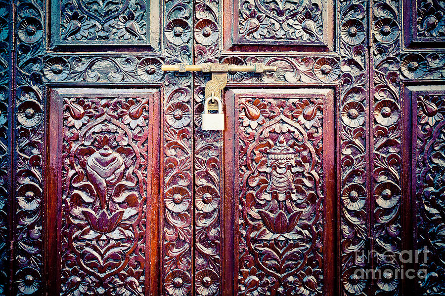  Door with buddhist symbols in Kathmandu Photograph by Raimond Klavins