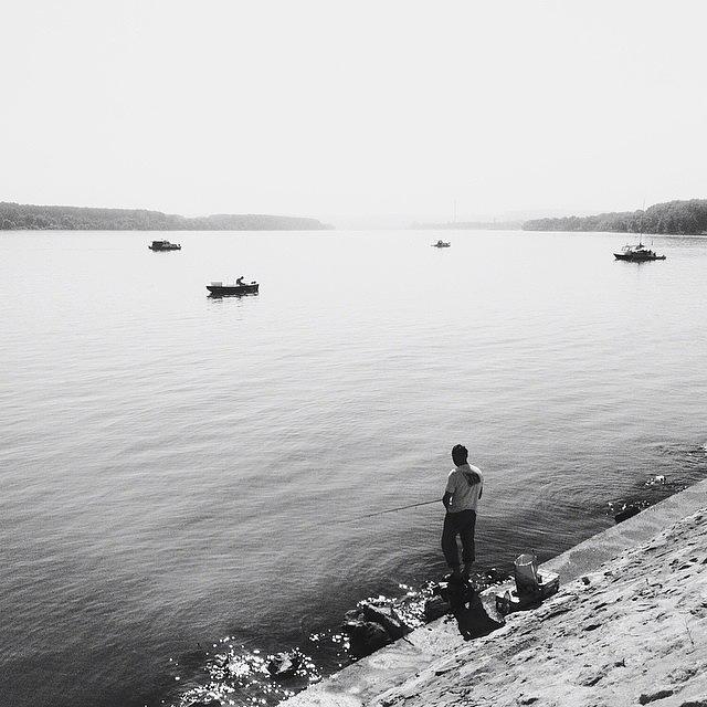 | Lone Fisherman On Danube • Early Photograph by Nenad Nikolic