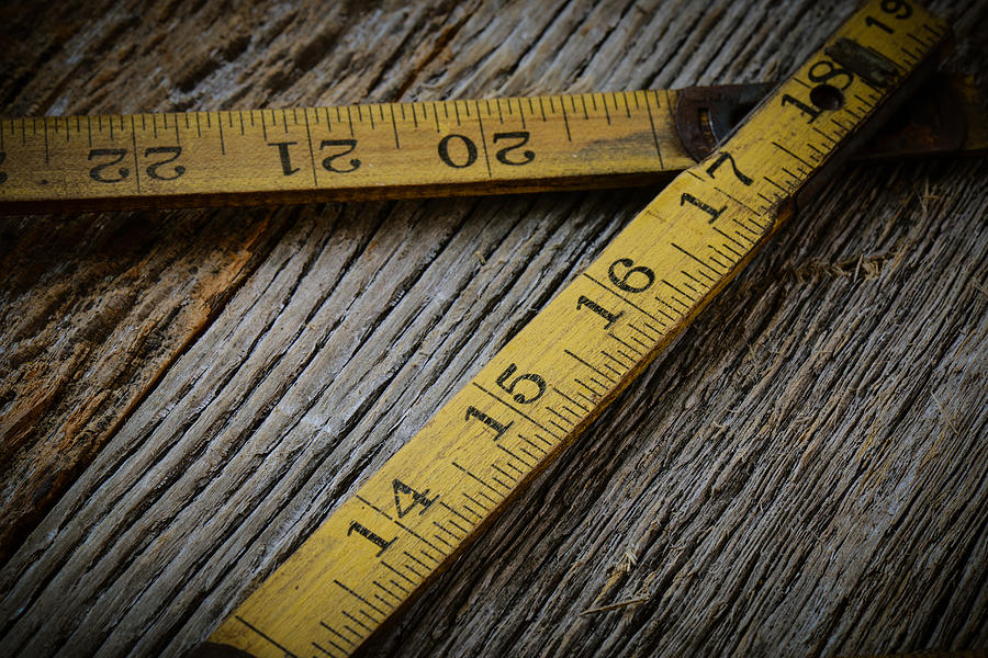  Old Tape Measure on Rustic Wood Background Photograph by Brandon Bourdages
