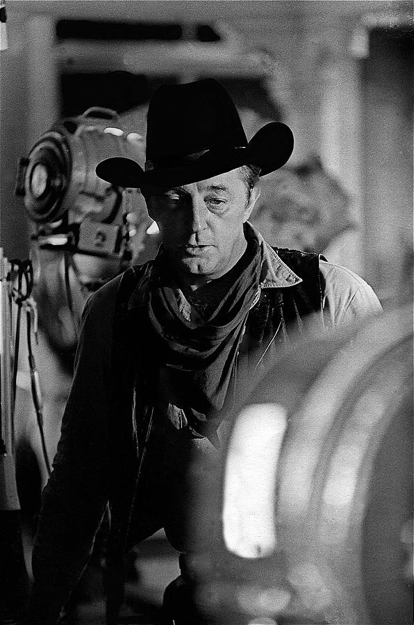  Robert Mitchum lights Young Billy Young set  Old Tucson Photograph by David Lee Guss