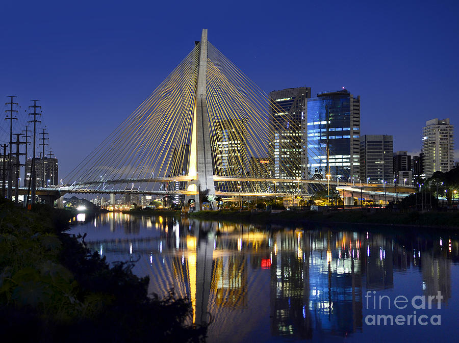  Sao Paulos iconic cable-stayed bridge and its reflex over Pinh Photograph by Carlos Alkmin