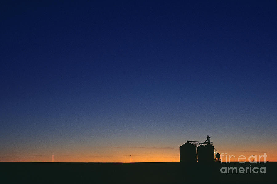  Silhouetted grain silo Photograph by Jim Corwin