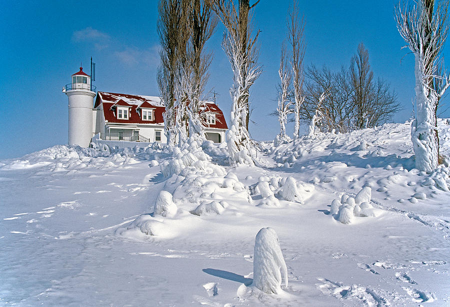  Winter lighthouse Photograph by Dennis Cox