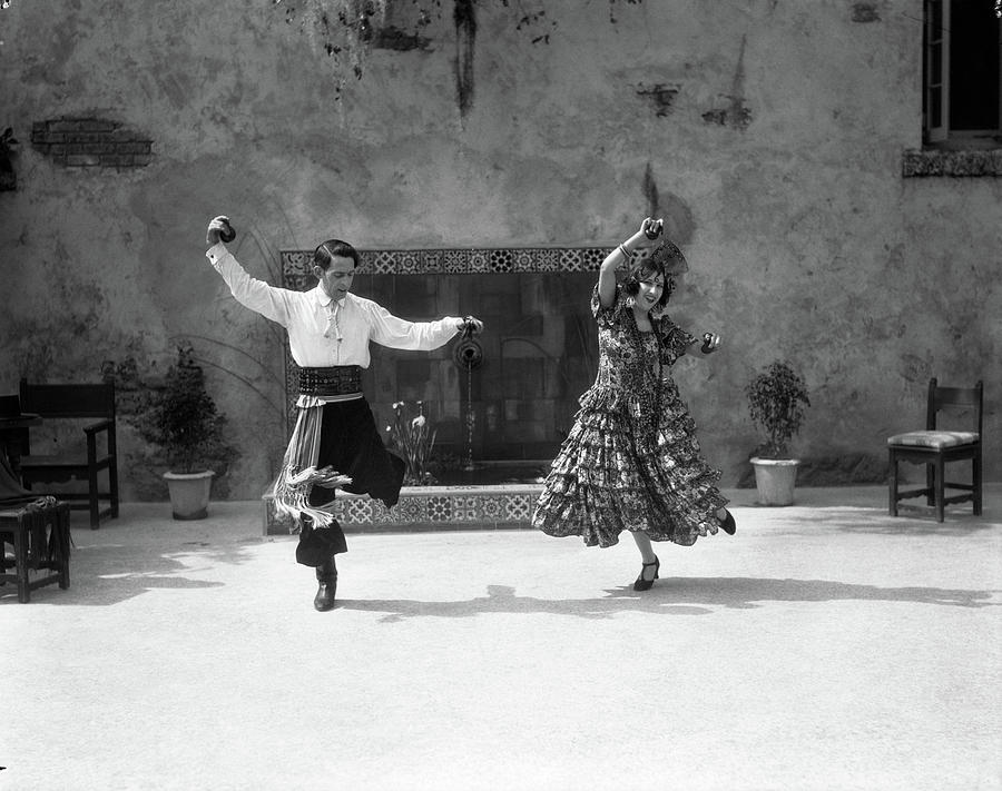 1920s Smiling Couple Dressed In Spanish Photograph by Vintage Images