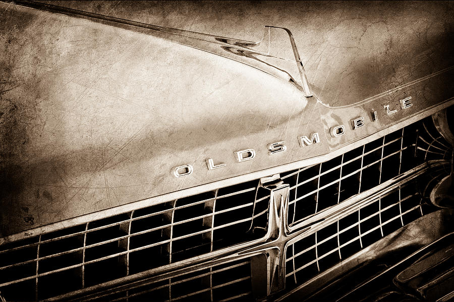 1963 Oldsmobile Starfire Grille Emblem Photograph by Jill Reger