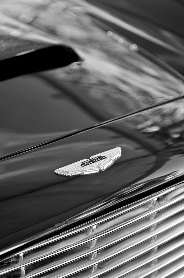 Black And White Photograph - 1967 Aston Martin DB6 Coupe Hood Emblem by Jill Reger