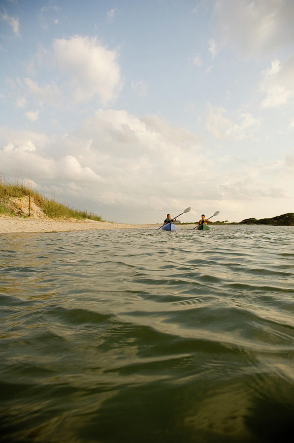 Beach Photograph - A Couple Paddles Kayaks Together #1 by David Nevala