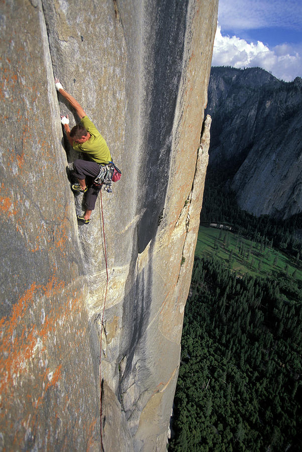 Yosemite National Park Photograph - A Man Crack Climbing A First Ascent #1 by Corey Rich