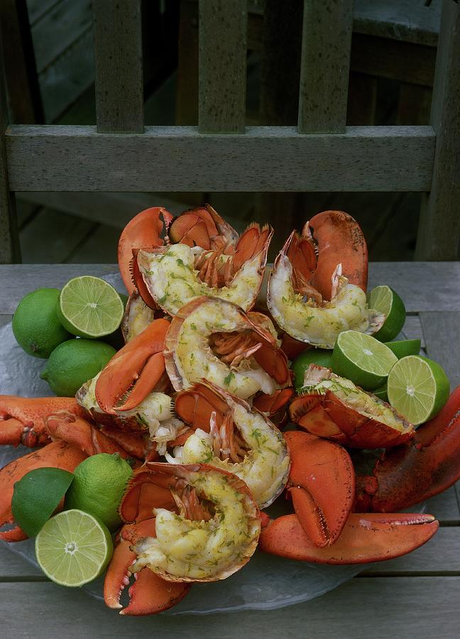 A Meal With Lobster And Limes Photograph by Romulo Yanes