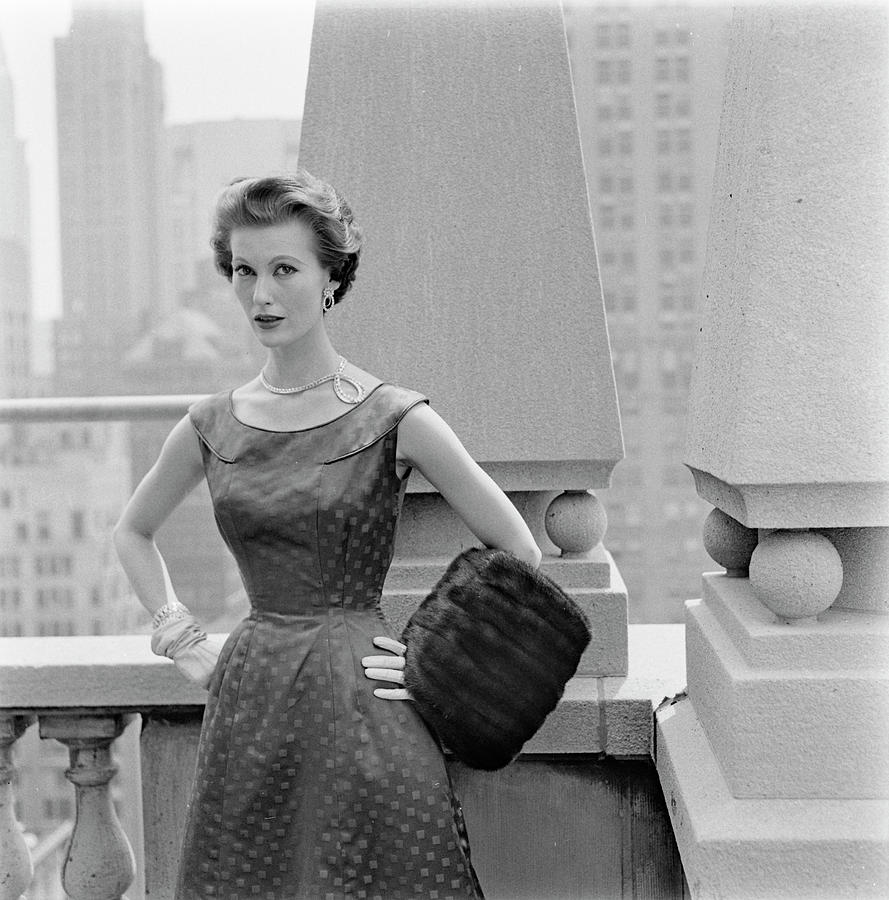 A Model Standing Against A Rooftop Column In An Photograph by Richard Rutledge