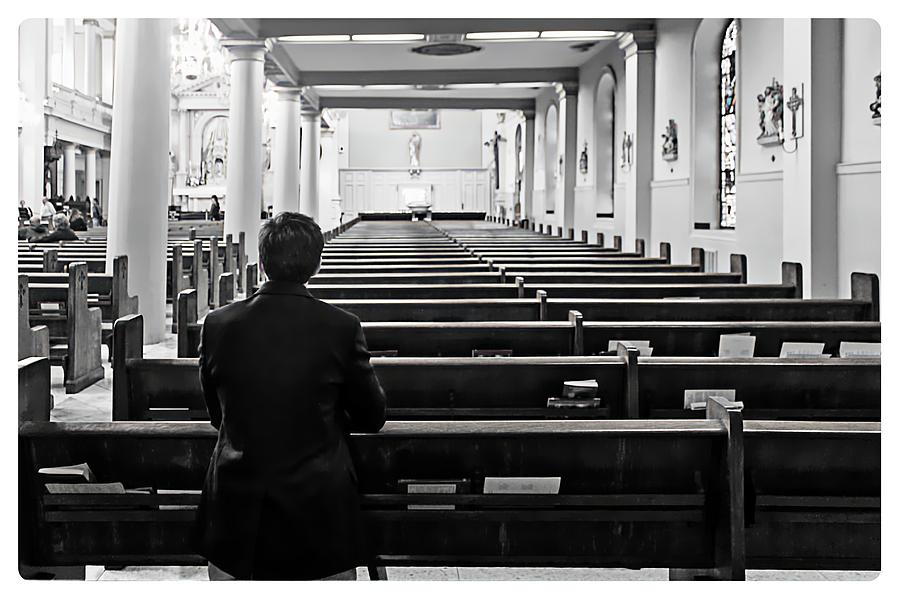 Praying in Church Photograph by Carlos Diaz
