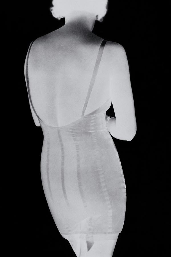 A Negative Print Of A Woman Wearing A Corset #1 Photograph by George Hoyningen-Huene