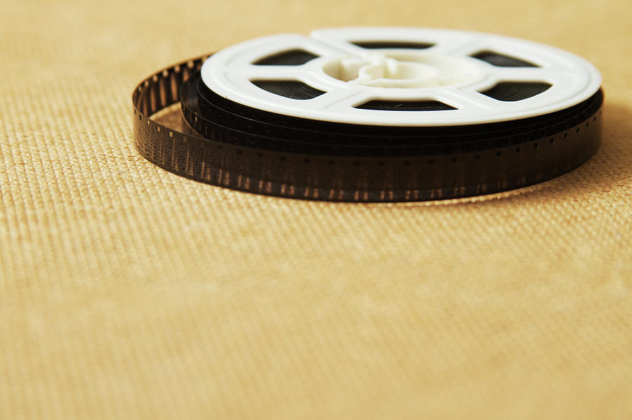A Reel, Or Spool, Of 8mm Movie Film #1 Photograph by Jon Schulte