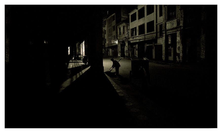 Confucius Photograph - A Street Sweeper Works Throught #1 by Simon ODwyer