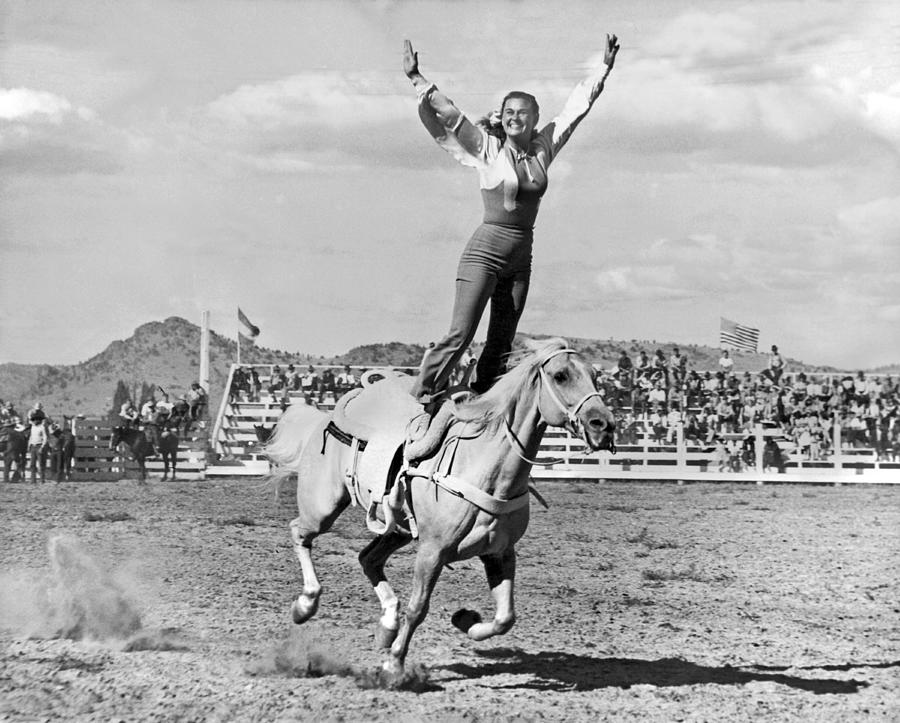 Daredevil Photograph - A Trickriding Cowgirl #2 by Underwood Archives