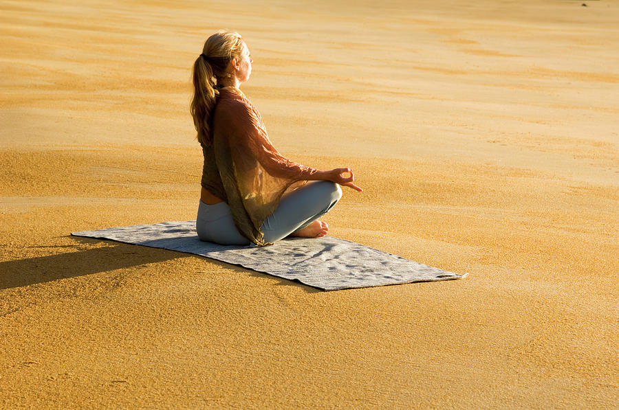 A Woman Practicing Yoga On A Beach Photograph by Lars Schneider - Fine ...