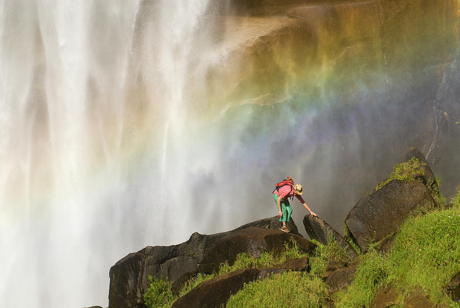 A Young Woman Explores Beneath A Giant Photograph by Doug Marshall ...