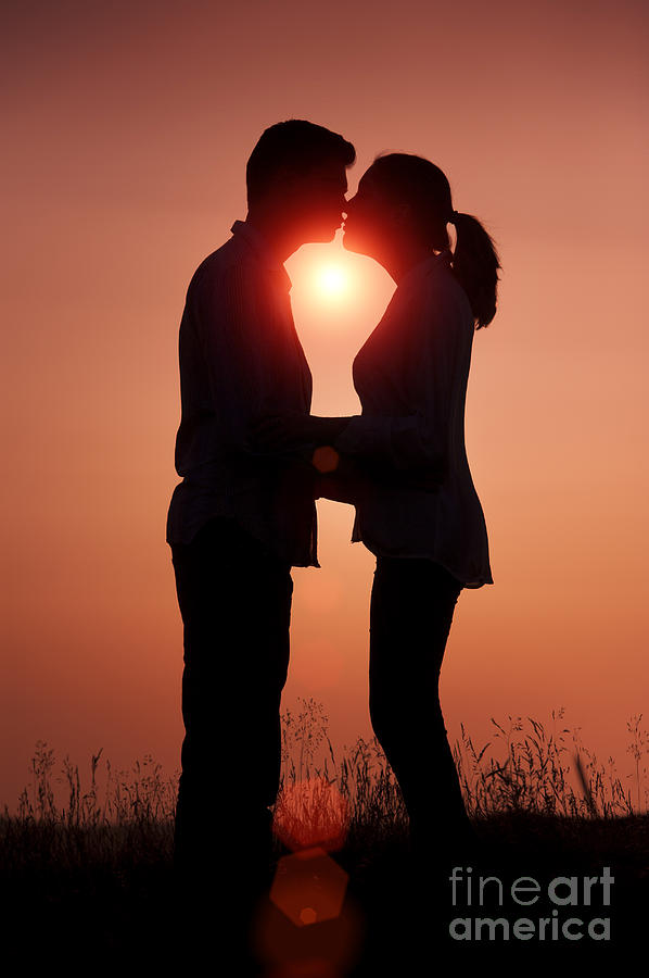 Sunset Photograph - Affectionate Couple At Sunset In Profile  #1 by Lee Avison