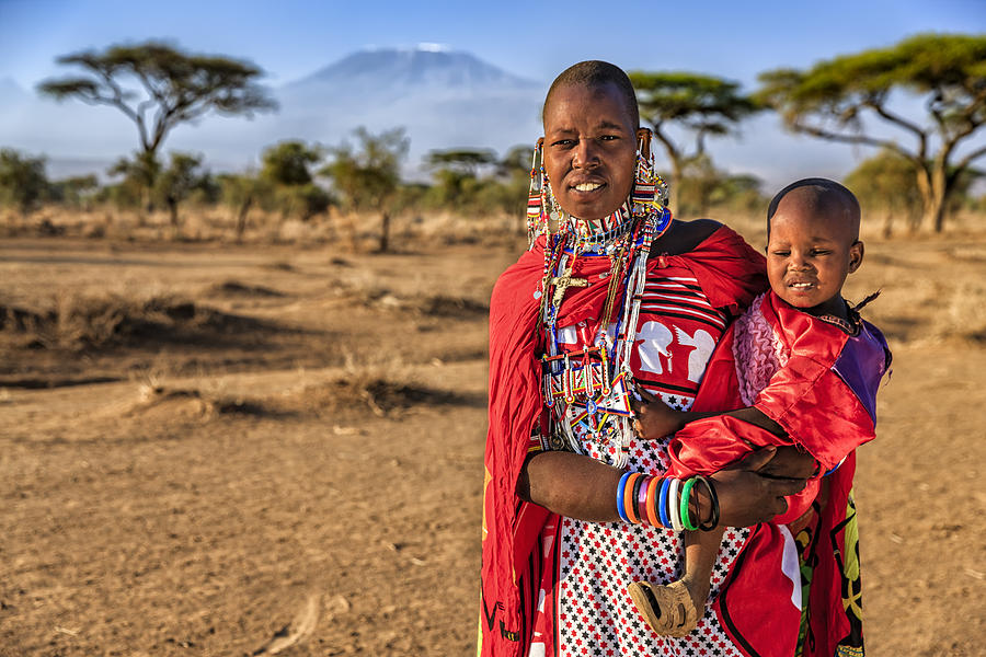 African woman carrying her baby, Kenya, East Africa #1 Photograph by Bartosz Hadyniak