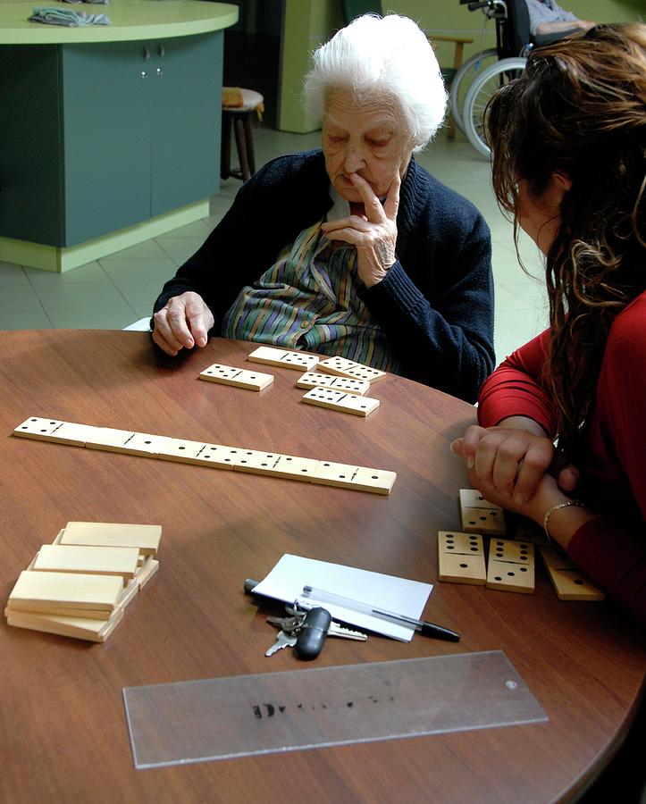 Alzheimers Photograph - Alzheimers Patient Plays Dominoes #1 by Aj Photo/science Photo Library