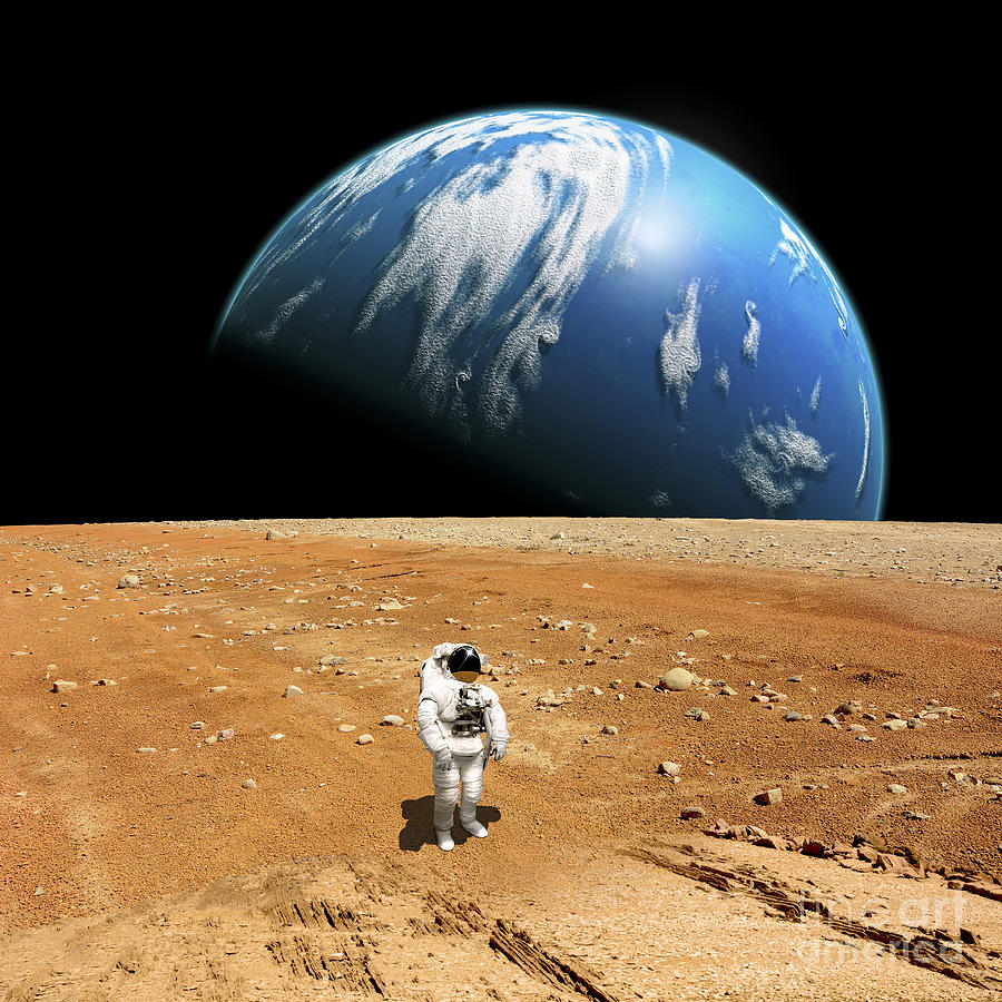 Science Fiction Photograph - An Astronaut Standing On A Barren World #1 by Marc Ward
