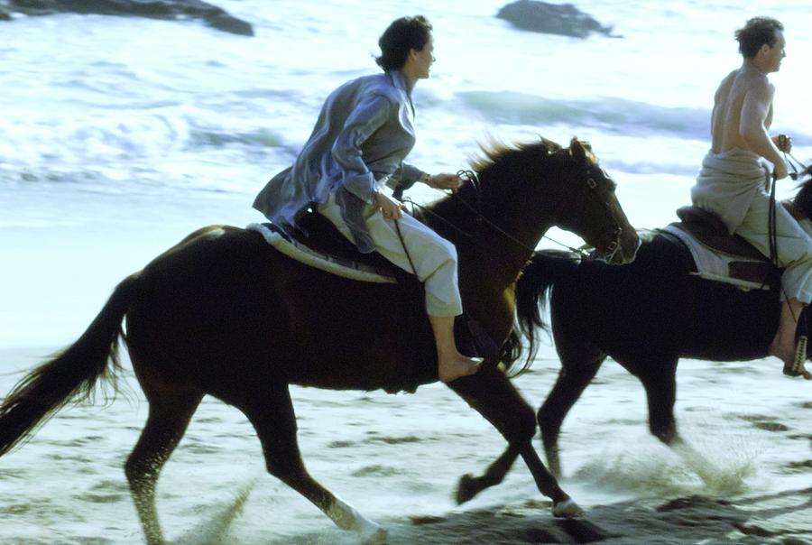 Andie Macdowell And Paul Qualley Riding Horses Photograph by Arthur Elgort