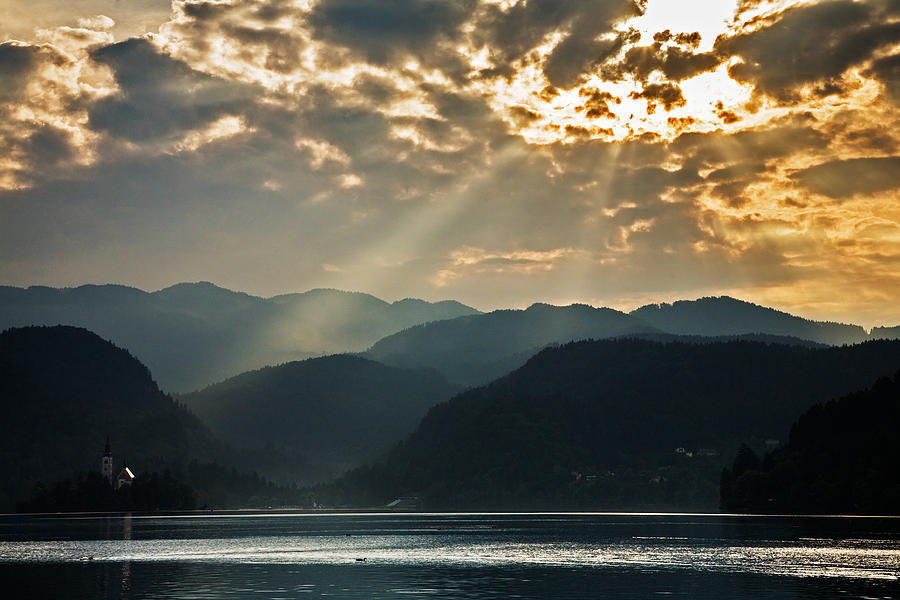Angel rays over Lake Bled #1 Photograph by Ian Middleton