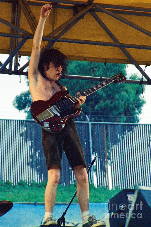 Angus Young of A C D C at Day on the Green Monsters of Rock - July 1979 Photograph by Daniel Larsen